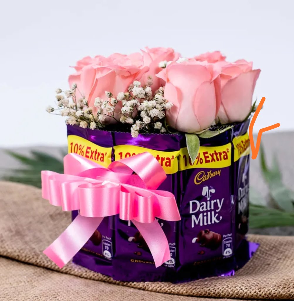 8 pink roses and 10 dairy milk Choclates of 12 gm each