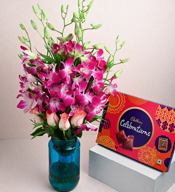 orchid n soses in blue vase with celebration orchid n soses in blue vase with celebration